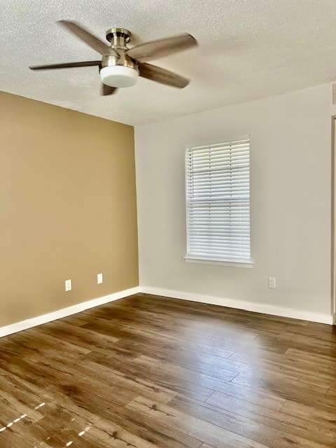 spare room with a textured ceiling, hardwood / wood-style floors, and ceiling fan