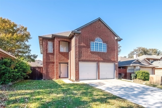 view of front property with a garage and a front lawn