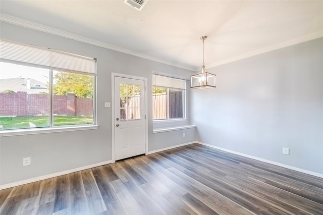 interior space with dark hardwood / wood-style floors and crown molding