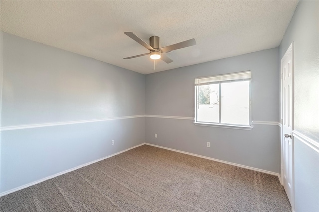 empty room featuring carpet flooring, ceiling fan, and a textured ceiling