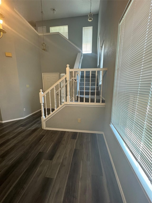 interior space with an inviting chandelier and hardwood / wood-style flooring