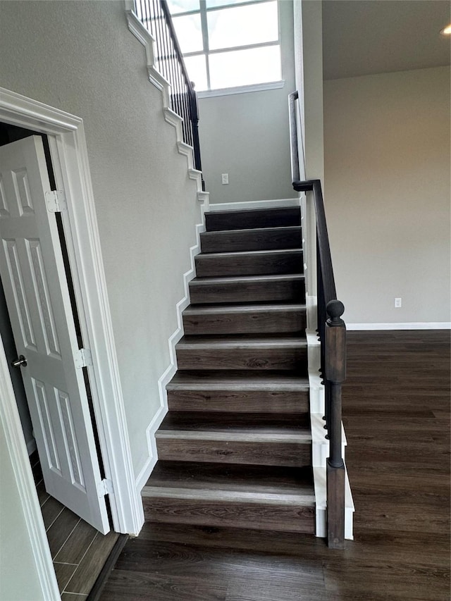 stairway featuring hardwood / wood-style flooring