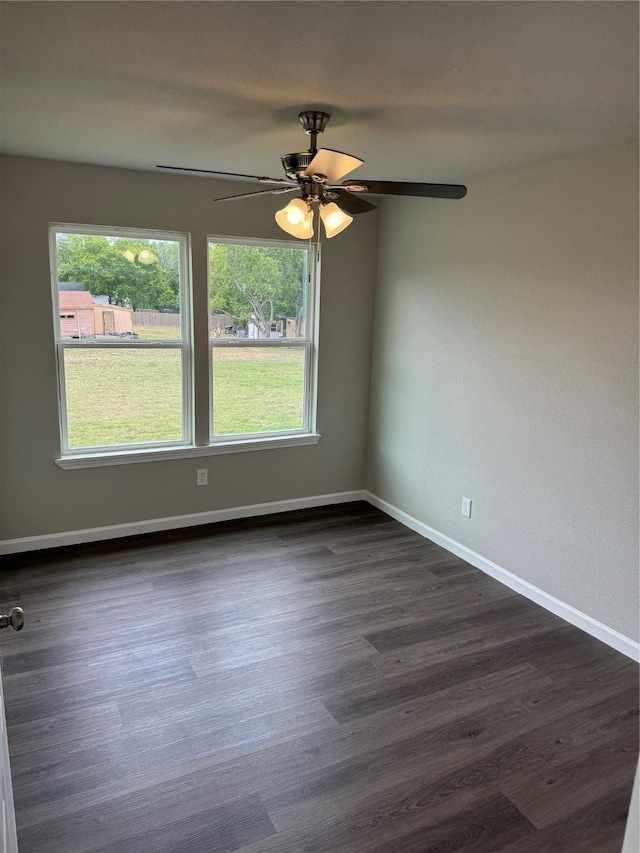 unfurnished room featuring ceiling fan and dark hardwood / wood-style floors