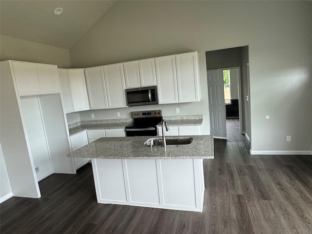 kitchen featuring stainless steel appliances, sink, a center island with sink, and white cabinets