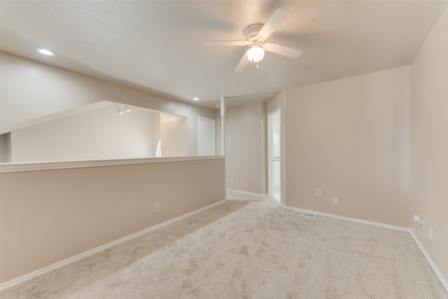 empty room featuring carpet and ceiling fan