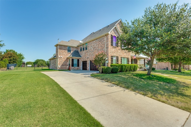 view of front facade featuring a front lawn and a garage