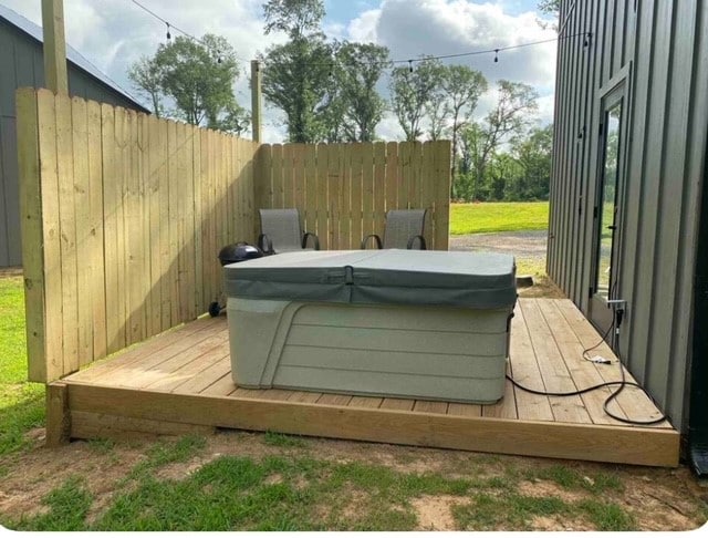 view of storm shelter featuring a hot tub