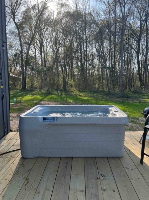 deck featuring a hot tub