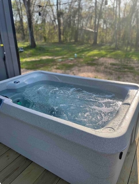 exterior space featuring a hot tub