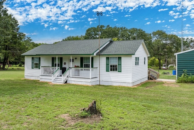 ranch-style house featuring a porch and a front yard