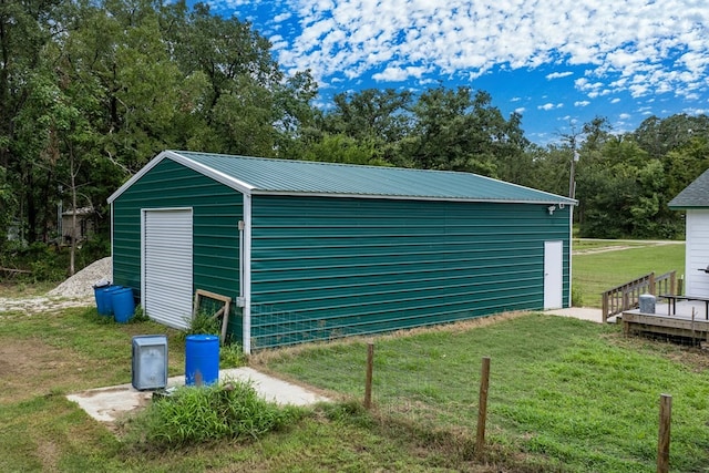 garage with a yard