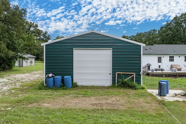 garage featuring a lawn