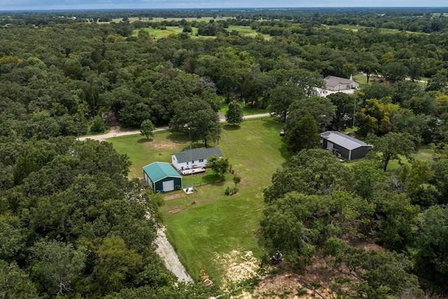 aerial view featuring a wooded view