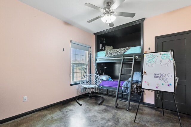 interior space featuring concrete flooring and ceiling fan