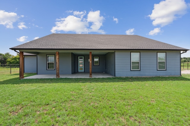 back of house featuring a lawn