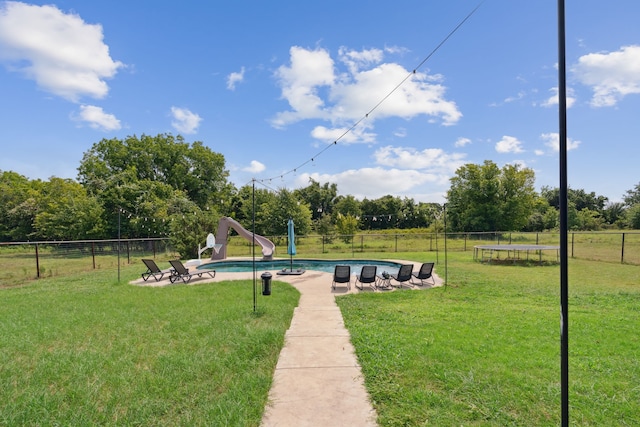 exterior space with a fenced in pool