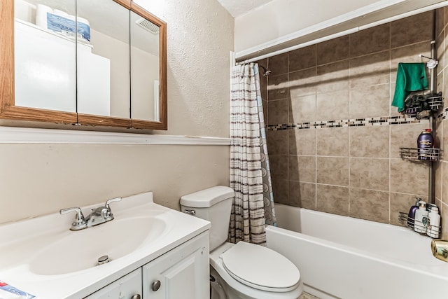 full bathroom featuring vanity, shower / tub combo, and toilet