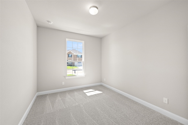 unfurnished room featuring carpet floors