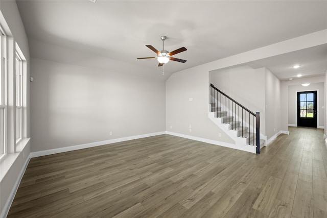 unfurnished room with dark hardwood / wood-style flooring and ceiling fan