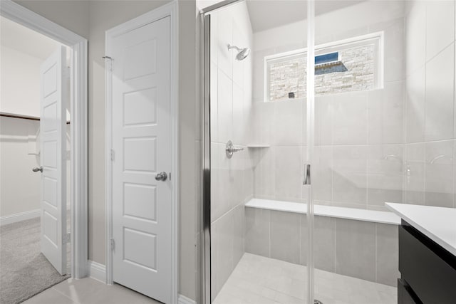 bathroom featuring vanity and a shower with shower door