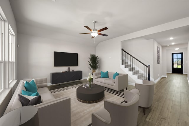 living room with ceiling fan and light hardwood / wood-style flooring