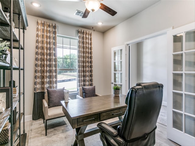 office with ceiling fan, light hardwood / wood-style flooring, and french doors