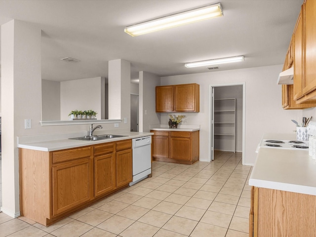 kitchen with sink, light tile patterned floors, and dishwasher