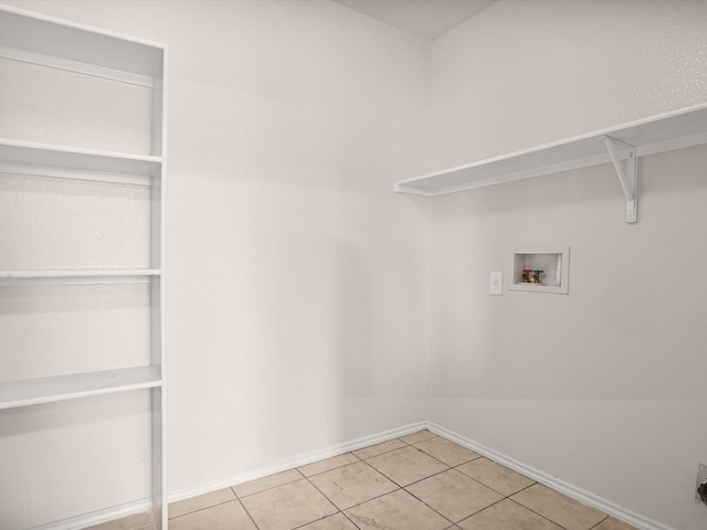 laundry area featuring light tile patterned flooring and washer hookup