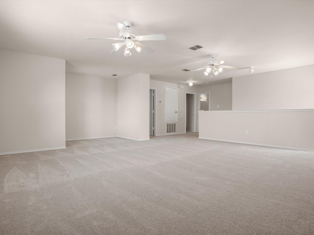 unfurnished room featuring light colored carpet and ceiling fan