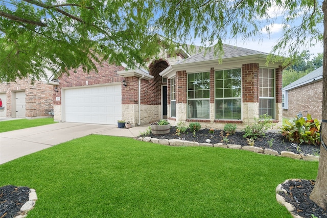 ranch-style home with a front yard and a garage