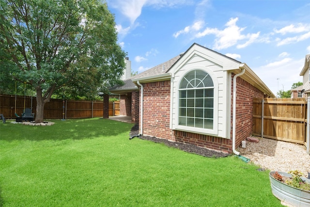 view of home's exterior featuring a yard