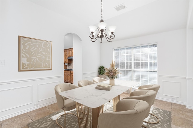 dining room featuring an inviting chandelier and light tile patterned floors