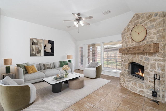 tiled living room with lofted ceiling, a fireplace, and ceiling fan