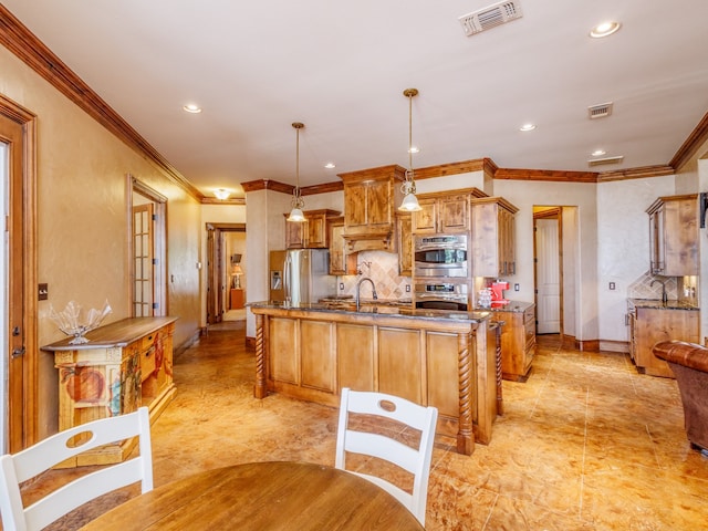 kitchen with backsplash, light tile patterned floors, stainless steel appliances, pendant lighting, and a center island with sink