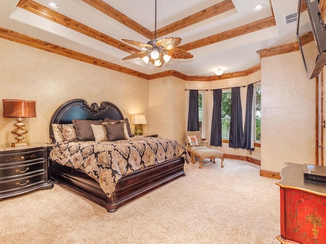 carpeted bedroom featuring a raised ceiling, visible vents, crown molding, and baseboards