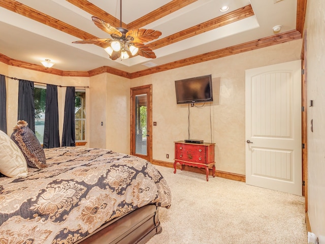 carpeted bedroom featuring a tray ceiling, ceiling fan, access to exterior, and crown molding