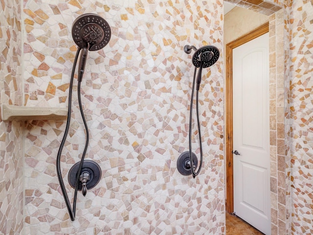 interior details with a tile shower