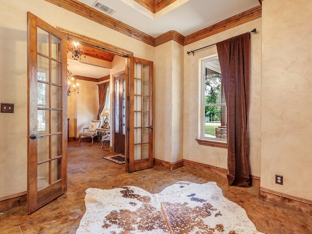 interior space featuring ornamental molding, french doors, and a chandelier