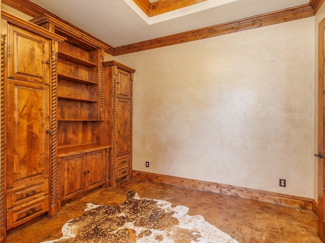 unfurnished room featuring ornamental molding, built in shelves, and baseboards