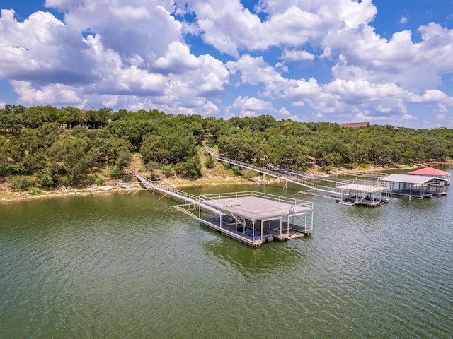 exterior space featuring a water view and a forest view