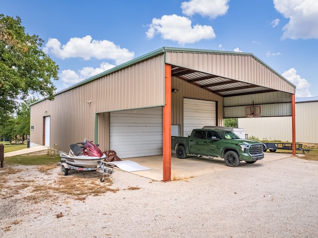 garage featuring a carport