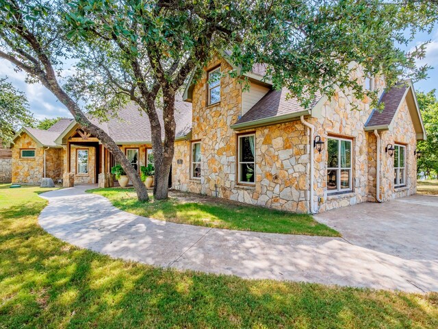 view of front of home with a front lawn