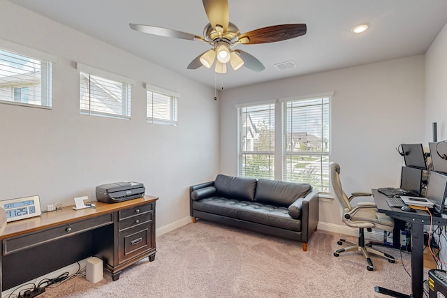 carpeted home office with ceiling fan