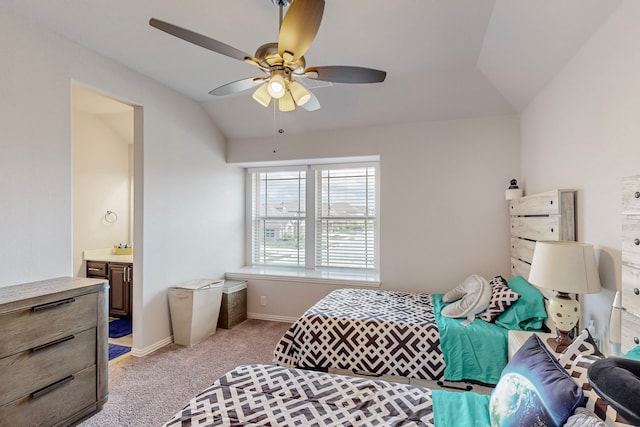 carpeted bedroom with ensuite bath, ceiling fan, and lofted ceiling