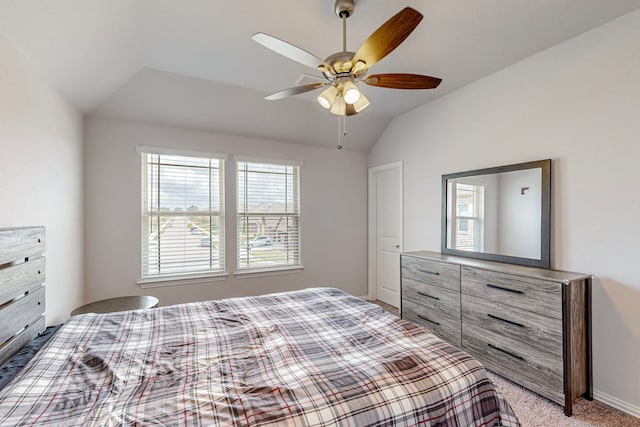 bedroom featuring light colored carpet, multiple windows, and ceiling fan