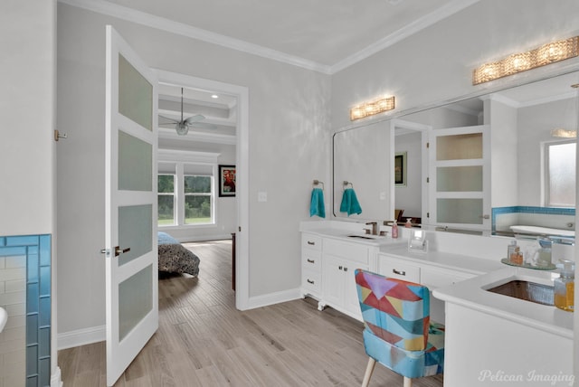 bathroom featuring coffered ceiling, hardwood / wood-style floors, ceiling fan, crown molding, and vanity