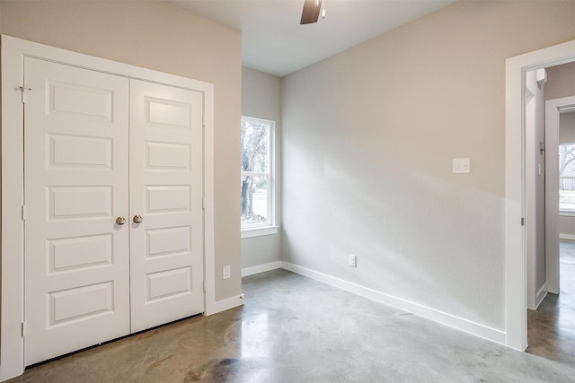 unfurnished bedroom with a closet and ceiling fan