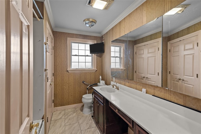 bathroom featuring crown molding, vanity, and toilet