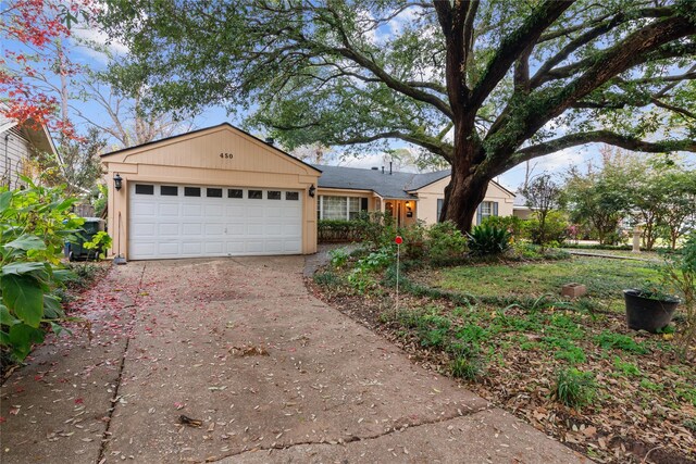 single story home featuring a garage