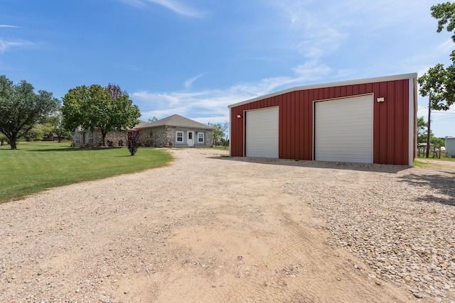 garage featuring a yard